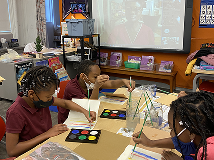 Whittier Elementary School students participate in an art activity led by the author