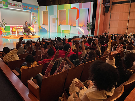 Author Jacqueline Woodson with students at The Kennedy Center.